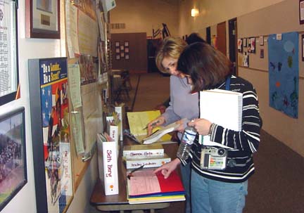 Participants learn about the assessment systems by examining children's portfolios.